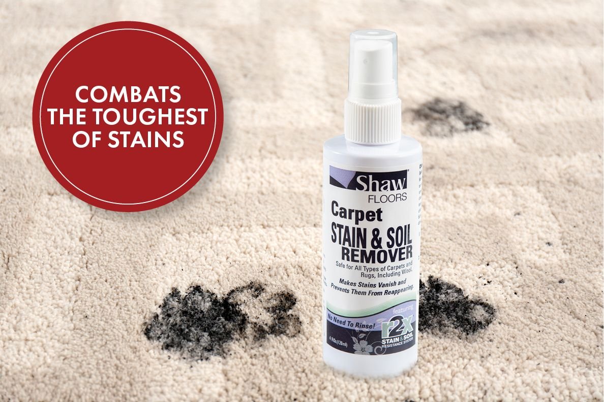Shaw Floors Carpet Stain & Soil Remover cleaning product on carpet next to dark stain